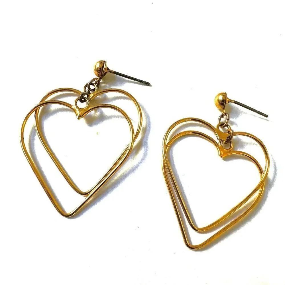 Gold tone double heart dangling earrings